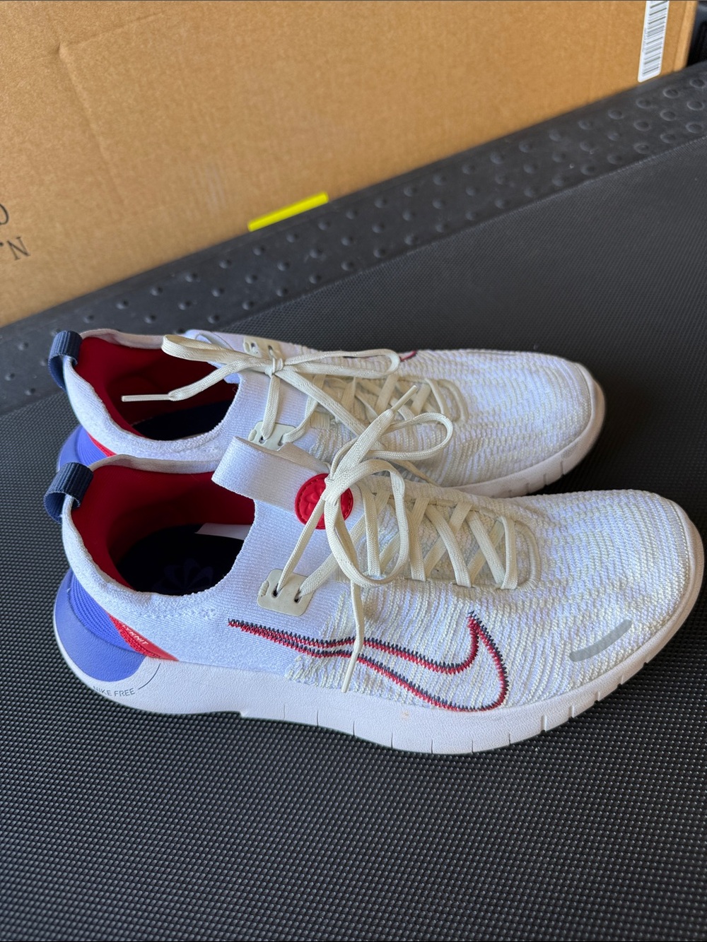 Nike White Knit Free Runs with Red & Blue Accents